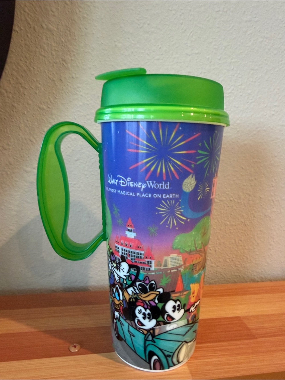 Disney Multicolor Fireworks Travel Mug with Green Lid and Handle